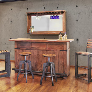 他の地域の中サイズのインダストリアルスタイルのおしゃれなウェットバー (家具調キャビネット、中間色木目調キャビネット、木材カウンター、グレーのキッチンパネル、セメントタイルのキッチンパネル、無垢フローリング、茶色い床) の写真