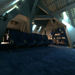 Example of a large trendy enclosed carpeted home theater design in Nantes with gray walls and a projector screen