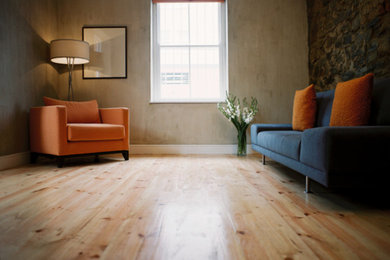 Living room - mid-sized contemporary formal and enclosed light wood floor living room idea in Bridgeport with beige walls and no fireplace