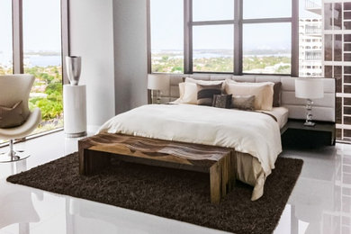 Inspiration for a contemporary master white floor bedroom remodel in Miami with gray walls