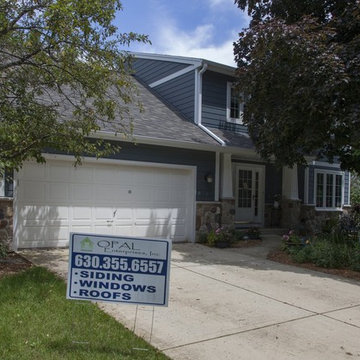 Shiny new Andersen Windows, Evening Blue James Hardie siding & stone accents