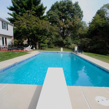 Classic Rectangle style in-ground salt water pool with diving board