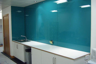 Kitchen Back-splash made out in colored glass.