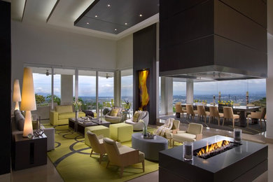 Huge trendy formal and open concept porcelain tile living room photo in Miami with white walls, a two-sided fireplace and no tv