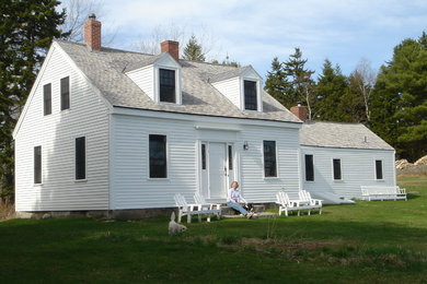 Mid-sized farmhouse white two-story wood gable roof photo in Portland Maine