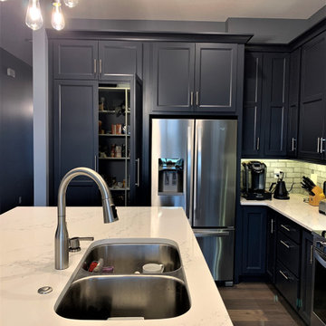 Dark Charcoal Blue Painted Kitchen With Bar Height Island