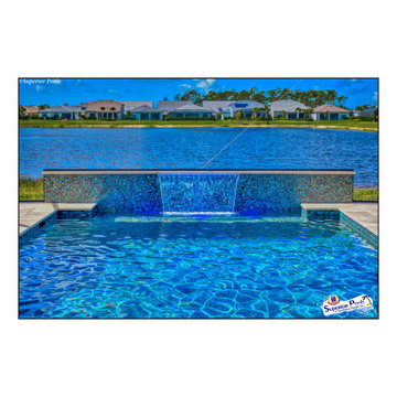 (Rennehan) FT MYERS FL Superior Pools Swimming Pool With Raised Wall & Waterfall