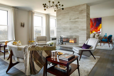 Example of a huge transitional open concept dark wood floor living room design in New York with gray walls, a two-sided fireplace, a stone fireplace and a wall-mounted tv