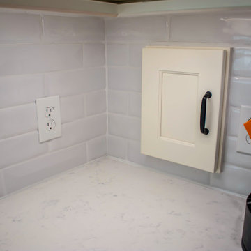Custom Two-Toned Green and White Kitchen with Laventa Carrara Quartz Countertops