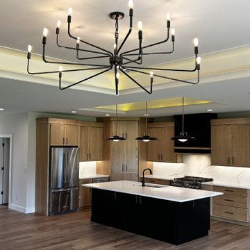 Maple Pecan Stain and Painted Black Kitchen Design in Bettendorf, Iowa