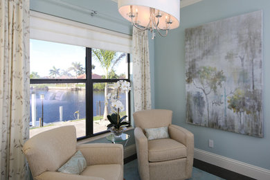 Inspiration for a large contemporary master dark wood floor and brown floor bedroom remodel in Miami with blue walls and no fireplace