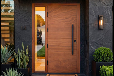 Example of a large minimalist entryway design in Miami with a medium wood front door