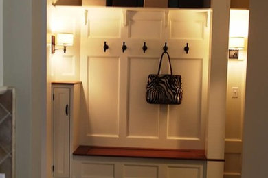 Hallway - mid-sized traditional slate floor hallway idea in New York with beige walls