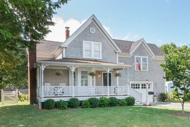 Example of a classic gray two-story wood exterior home design in Boston with a shingle roof