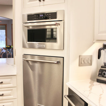 Ivory White Kitchen With Marble Look Quartz Counters and Splash