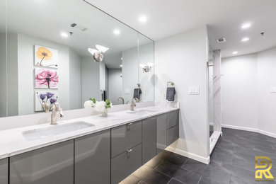 Mid-sized minimalist master white tile porcelain tile, black floor and single-sink shower bench photo in Dallas with flat-panel cabinets, gray cabinets, an undermount sink, quartz countertops, a hinged shower door, white countertops and a floating vanity