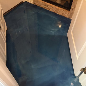 Pool house floor with blue metallic epoxy