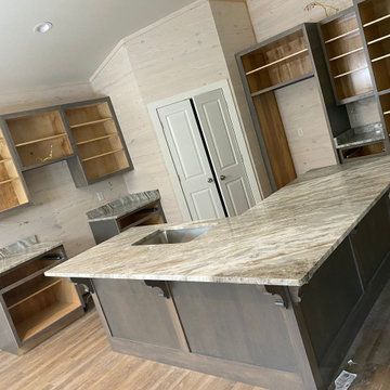 Fantasy Brown Dolomite Countertops w/ Light Wood Walls & Washed Wood Cabinets