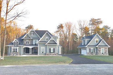 Inspiration for a large timeless gray three-story concrete fiberboard house exterior remodel in Baltimore with a hip roof and a shingle roof