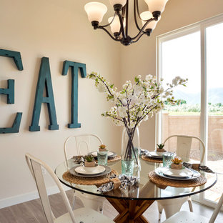 Farmhouse laminate floor and brown floor dining room photo in Salt Lake City with beige walls