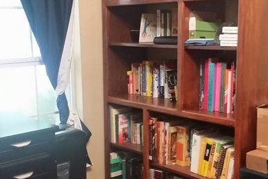 Example of a mid-sized classic freestanding desk home office design in Austin with beige walls