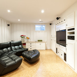 Medium sized traditional fully buried basement in Other with white walls, cork flooring, no fireplace and yellow floors.