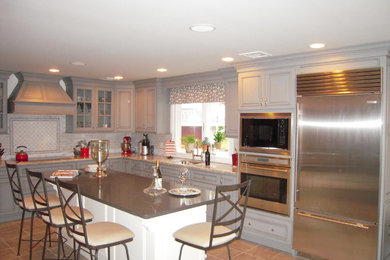 Example of a transitional kitchen design in New York