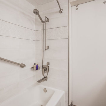 Primary Bathroom Tub with Sliding Door