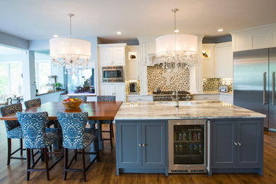 Inspiration for a large traditional l-shaped eat-in kitchen in Cincinnati with an undermount sink, shaker cabinets, white cabinets, granite benchtops, multi-coloured splashback, mosaic tile splashback, stainless steel appliances, medium hardwood floors, with island, brown floor and multi-coloured benchtop.