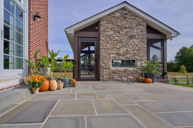 Large backyard patio photo in Philadelphia with no cover