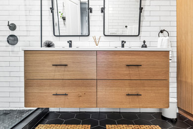 This is an example of a mid-sized contemporary master wet room bathroom in Chicago with flat-panel cabinets, medium wood cabinets, a one-piece toilet, white tile, white walls, an undermount sink, engineered quartz benchtops, black floor, a hinged shower door, white benchtops, a double vanity and a built-in vanity.