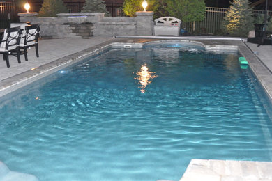 Island style pool photo in Chicago
