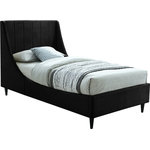 Meridian Furniture - Eva Velvet Upholstered Bed, Black, Twin - Snuggle up to a pet or other loved one in this richly upholstered Eva black velvet twin size bed for the ultimate in rest and relaxation. The wing back headboard has cushioned vertical deep channel tufting, and both the side rails and footboard are upholstered too for your comfort. Tapered black wood legs match the upholstery and support this contemporary bed, elevating it sufficiently that you can store items underneath.