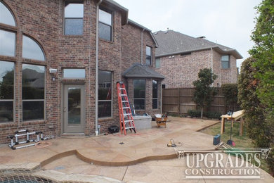 Inspiration for a mid-sized rustic backyard patio remodel in Dallas with a roof extension