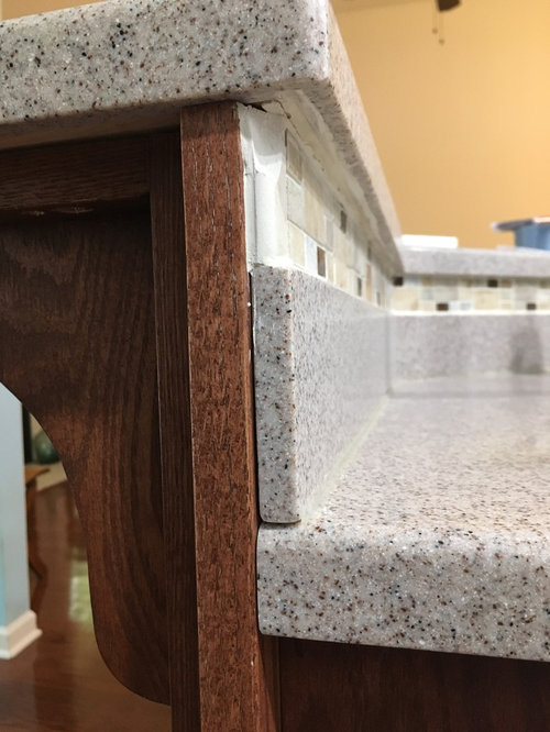 how to remove tile behind sink (on wood, under raised bar)