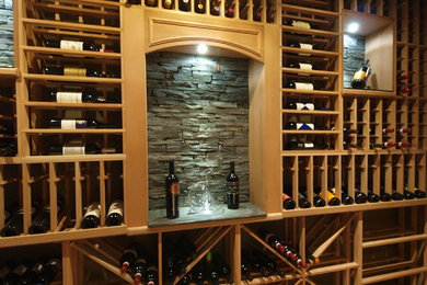Inspiration for a mid-sized contemporary wine cellar remodel in Calgary