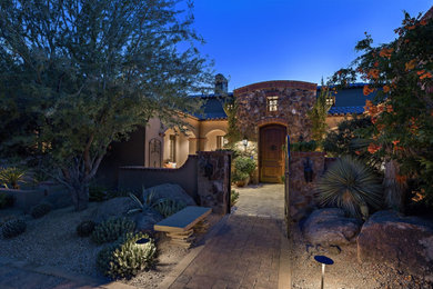 Example of a tuscan home design design in Phoenix