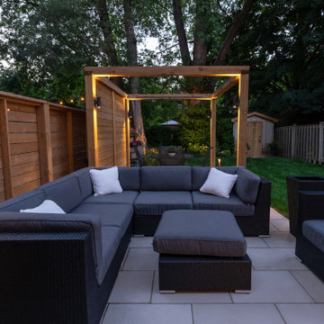 Modern Cedar Pergola, Porcelain Patio & Outdoor Lighting Backyard Renovation