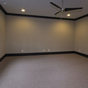 Game room with carpet and dark wood crown molding