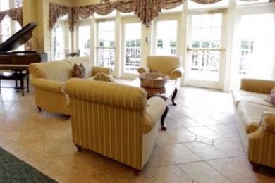 Example of a large classic open concept ceramic tile and beige floor living room design in Philadelphia with a music area, brown walls and no fireplace