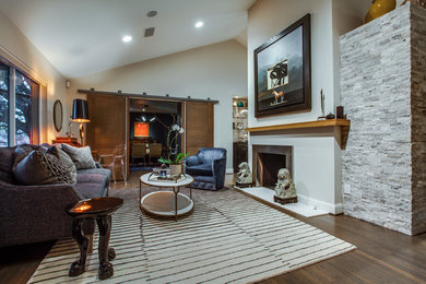 This is an example of a mid-sized contemporary formal open concept living room in Dallas with beige walls, medium hardwood floors, a two-sided fireplace, a metal fireplace surround and no tv.