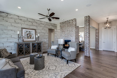 Inspiration for a transitional open concept medium tone wood floor living room remodel in Wichita with multicolored walls and no fireplace