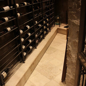 Wine Cellar with aged limestone elements and belgian bluestone floors