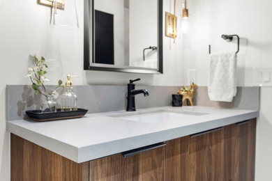 Example of a small trendy ceramic tile, multicolored floor and single-sink bathroom design in Phoenix with flat-panel cabinets, medium tone wood cabinets, white walls, an undermount sink, quartz countertops, gray countertops and a floating vanity