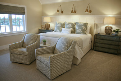 Photo of a mid-sized beach style guest bedroom in Milwaukee with beige walls, carpet, beige floor and vaulted.