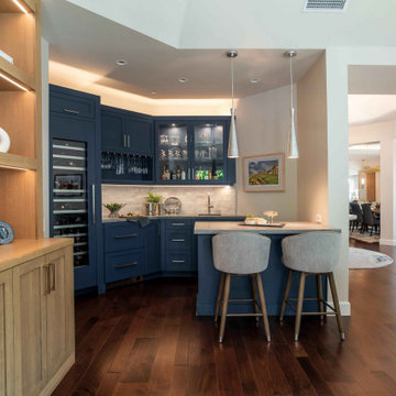 San Diego Home Bar with Navy Cabinets, Wine Storage, and Quartz Countertops