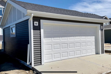 Inspiration for a large modern detached two-car garage remodel in Edmonton