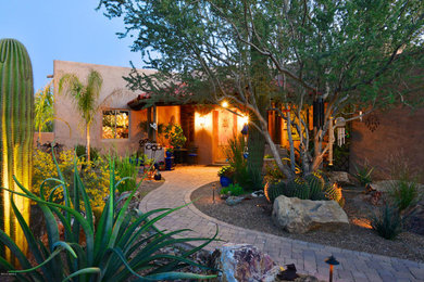 Large southwest beige one-story adobe exterior home photo in Phoenix