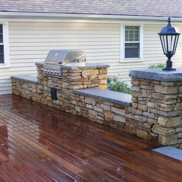 Deck and stone wall.