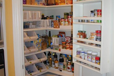 Inspiration for a mid-sized timeless l-shaped kitchen pantry remodel in Houston with open cabinets and no island